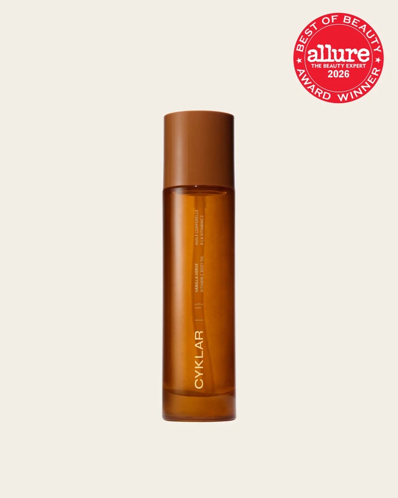 A bottle of CYKLAR body oil with a brown cap and transparent amber-colored liquid, featuring a label that reads 'vitamin expotole'. An 'Allure Best of Beauty Award 2026' badge is displayed in the top right corner.