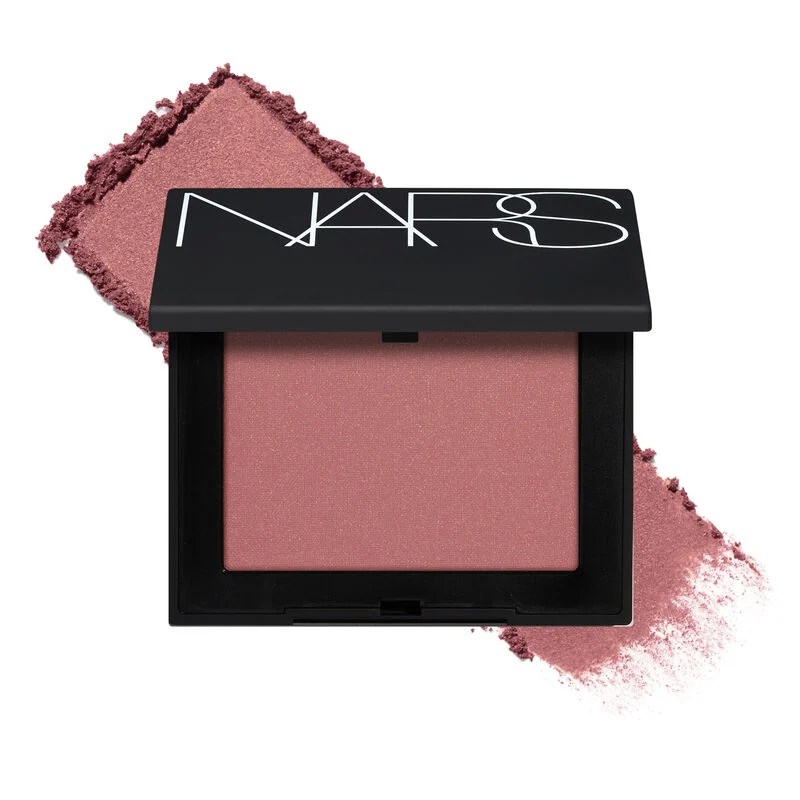 NARS blush compact with a pink hue and powder swatch in the background.