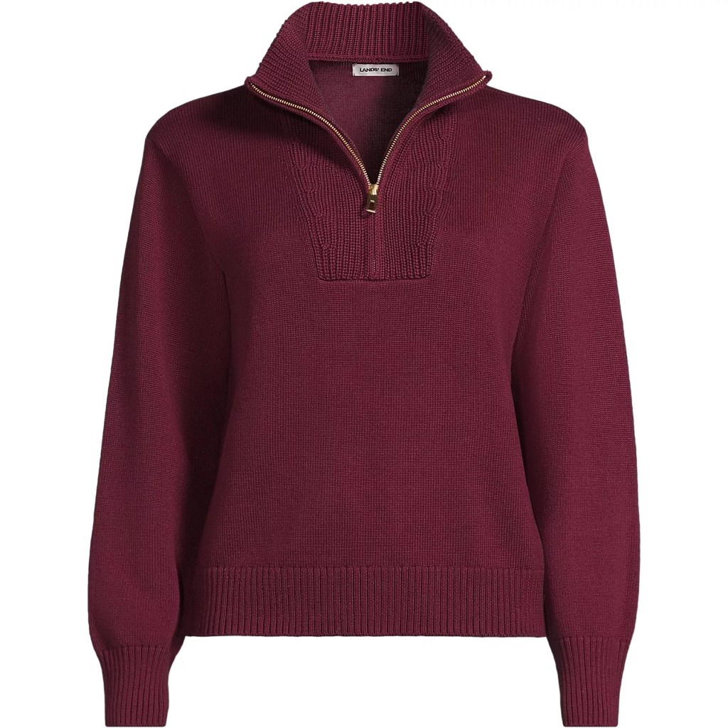 A burgundy quarter-zip sweater with a ribbed collar and cuffs.