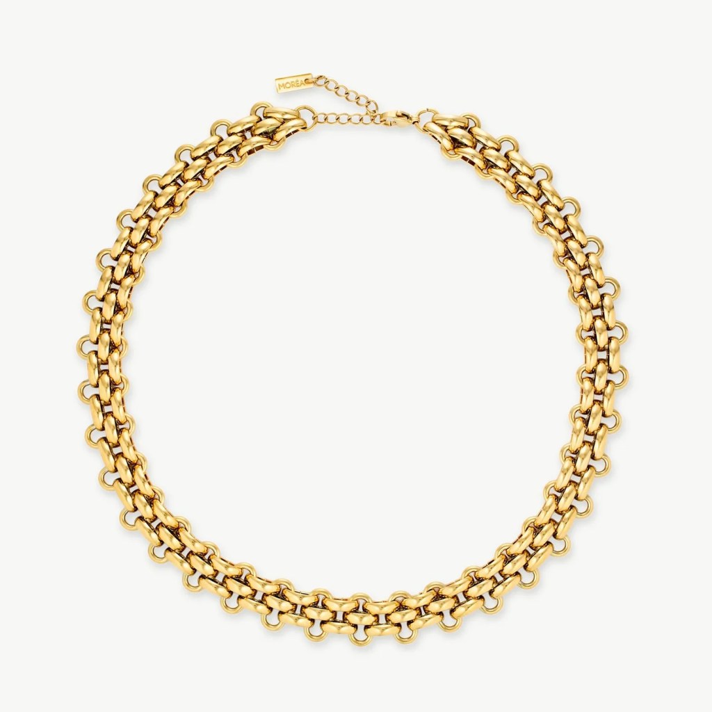 A gold chain necklace featuring interlocking links with a modern design.