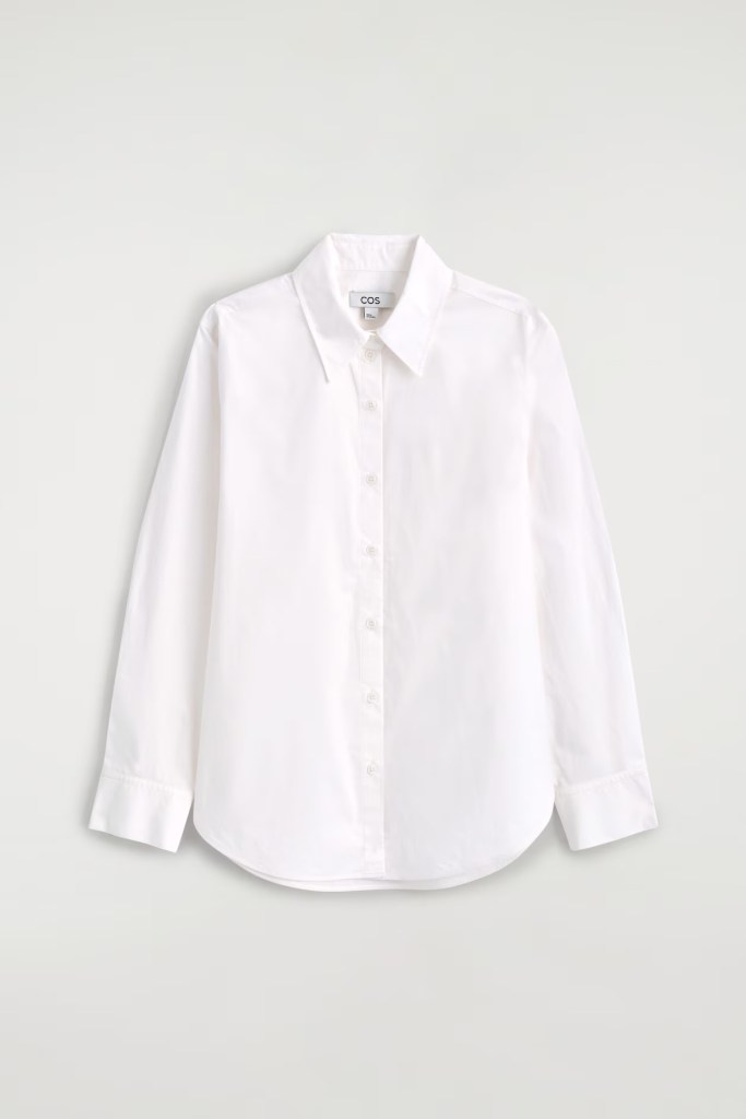 A white long-sleeve button-up shirt with a collar, displaying a minimalist design.