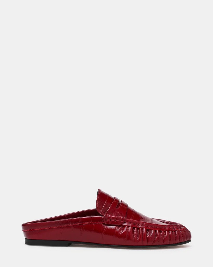 Side view of a stylish red leather slip-on loafer with a textured finish.
